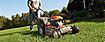 Man mowing lawn with a lawn mower